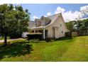 House exterior showcasing side yard and landscaping at 260 Shadowbrooke Dr, Loganville, GA 30052