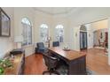 Bright home office with hardwood floors and built-in shelving at 7860 Wentworth Dr, Duluth, GA 30097