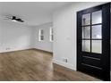 Bright and airy living room featuring hardwood floors and a ceiling fan at 9148 Homewood Dr, Riverdale, GA 30274