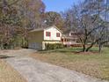 House exterior showcasing a two-car garage and driveway at 134 Mill Ct, Dallas, GA 30157