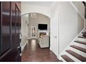 Inviting foyer with hardwood floors, a staircase, and a view of the living room at 609 Homestead Dr, Dallas, GA 30157