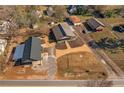 Wide aerial view of property, showing two houses and surrounding area at 1404 Cassville Nw Rd, Cartersville, GA 30121