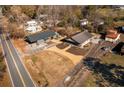 Aerial view showing a renovated house and additional building at 1404 Cassville Nw Rd, Cartersville, GA 30121