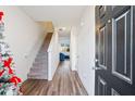 Bright entryway with hardwood floors and staircase at 579 Magnolia Circle Cir, Palmetto, GA 30268