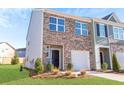 Two-story townhouse exterior with brick and siding at 579 Magnolia Circle Cir, Palmetto, GA 30268