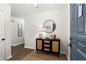 Bright entryway with dark wood floors and stylish console table at 1101 Juniper Ne St # 301, Atlanta, GA 30309