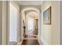 Bright hallway with hardwood floors and arched entryways at 3376 Peachtree Ne Rd # 47A, Atlanta, GA 30326