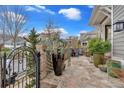 Landscaped front yard with a flagstone patio and wrought iron gate at 212 Mcaffee St, Woodstock, GA 30188