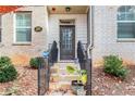 Modern townhome exterior with a dark brown front door and a Ring doorbell at 967 Allegro Park, Marietta, GA 30067