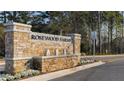 Rosewood Farms community entrance, with stonework and water feature at 2468 Bayberry St, Acworth, GA 30101