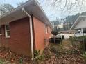 Brick home side view with satellite dish at 2893 Heather Dr, Atlanta, GA 30344