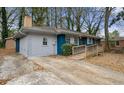Blue and gray ranch home with a wood ramp and driveway at 1089 Indale Sw Pl, Atlanta, GA 30310