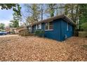 Side view of a charming blue ranch house with a wooden deck at 1089 Indale Sw Pl, Atlanta, GA 30310