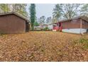Backyard with shed and wooded area at 1962 Pine Oak Sw Dr, Atlanta, GA 30310