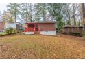 Spacious backyard with trees and shed at 1962 Pine Oak Sw Dr, Atlanta, GA 30310