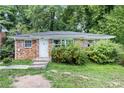 Brick house with a front yard, and a white door at 1279 Kenilworth Sw Dr, Atlanta, GA 30310