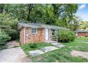 Brick ranch house with a landscaped yard at 1279 Kenilworth Sw Dr, Atlanta, GA 30310