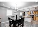 Bright dining area with modern light fixture and kitchen view at 406 Illinois Nw Ave, Atlanta, GA 30314