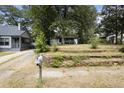 Property view from the street showcasing the house and yard at 1321 Mcclelland Ave, Atlanta, GA 30344
