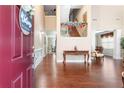 Two-story foyer with hardwood floors and elegant staircase at 1214 Glen Devon Pl, Powder Springs, GA 30127