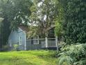 Ranch style home with blue siding and a covered porch at 1417 Graymont Sw Dr, Atlanta, GA 30310