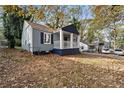 Charming gray house with a front porch and landscaped yard at 1417 Graymont Sw Dr, Atlanta, GA 30310