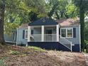 Blue house with white columns and a spacious front porch at 1417 Graymont Sw Dr, Atlanta, GA 30310