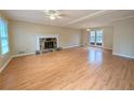 Spacious living room with hardwood floors and fireplace at 4106 Duesenburg Dr, Tucker, GA 30084