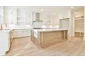 Bright, spacious kitchen with white cabinets, large island, and stainless steel appliances at 816 Hillwood Dr, Marietta, GA 30068