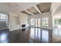 Open living room with fireplace, built-in shelves, and large windows overlooking backyard at 816 Hillwood Dr, Marietta, GA 30068