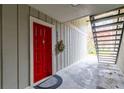 Condo entry with red door, wreath, and interior stairs at 1273 Branch Dr, Tucker, GA 30084