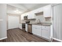 Modern kitchen with white cabinets, granite counters, and stainless steel appliances at 2707 Crescendo Nw Dr, Atlanta, GA 30318