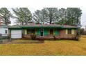 Ranch style home with green roofline and yard at 354 Tarragon Sw Way, Atlanta, GA 30331