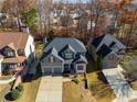 Aerial view showcasing a neighborhood with a gray-sided house at 243 Yorkshire Ln, Villa Rica, GA 30180