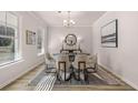 Formal dining room with hardwood floors, a round table, and neutral decor at 494 Hancock Se Dr, Atlanta, GA 30354