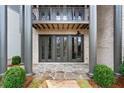 Charming backyard patio with flagstone flooring and French doors at 90 Sheridan Dr, Atlanta, GA 30305