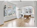 Open kitchen with white cabinets, large island, and hardwood floors at 90 Sheridan Dr, Atlanta, GA 30305