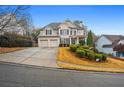 Beautiful traditional home with landscaping and a three-car garage at 204 Gold Valley Xing, Canton, GA 30114