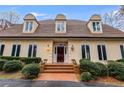 Elegant home with a charming entryway and professionally landscaped grounds at 4010 Paper Mill Se Rd, Marietta, GA 30067