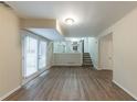 Finished basement with LVP flooring and access to patio at 3390 Glenview Sw Cir, Atlanta, GA 30331