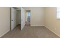 Bright bedroom featuring carpet, closet, and access to hallway at 3390 Glenview Sw Cir, Atlanta, GA 30331