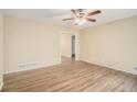 Spacious living room with hardwood floors and access to other rooms at 6979 Bruce Cir, Lithonia, GA 30058
