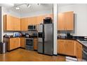 Modern kitchen with stainless steel appliances and light wood cabinets at 5300 Peachtree Rd # 108, Atlanta, GA 30341