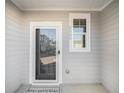Front porch with glass storm door and a 