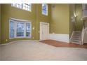 Spacious living room with large windows and hardwood floors at 1177 Preserve Park Dr, Loganville, GA 30052