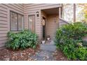 Inviting front entry with potted plants and lush greenery at 1504 Parkaire Xing, Marietta, GA 30068