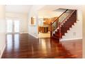 Open concept living area with hardwood floors, staircase, and view of the kitchen at 14 Rhodes Dr, Marietta, GA 30068