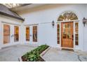 Inviting front entrance with a wooden door and sidelights at 5190 Holland Ct, Dunwoody, GA 30338