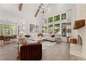 Spacious living room with hardwood floors, fireplace, and large windows at 336 Mont Harmony Sw Rd, Powder Springs, GA 30127