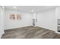 Finished basement with built-in shelving and hardwood floors at 4051 Glenda Dr, College Park, GA 30337